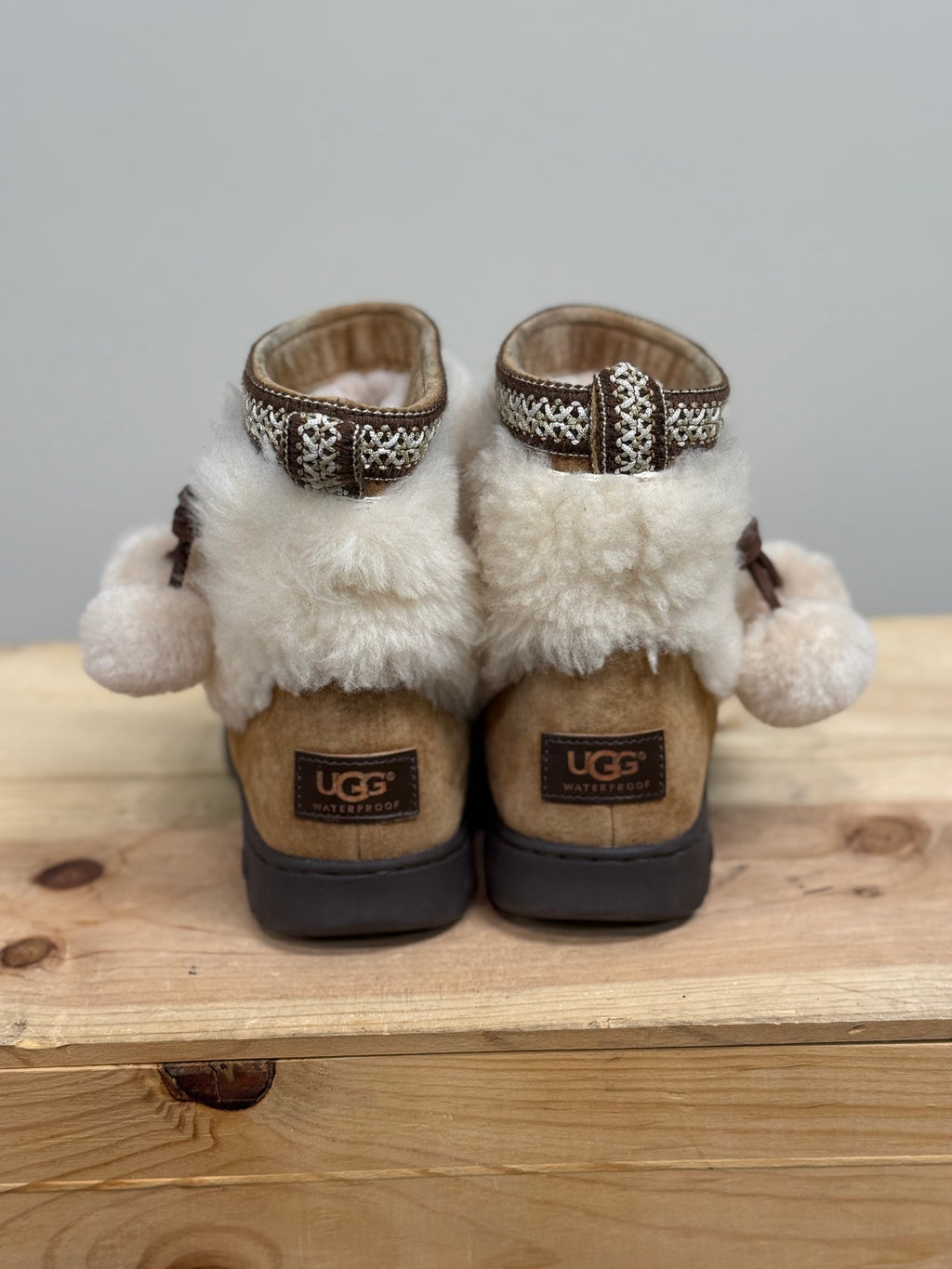 Ugg Brie sheepskin pom pom boots